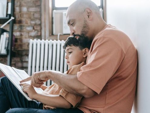 A parent and child reading together