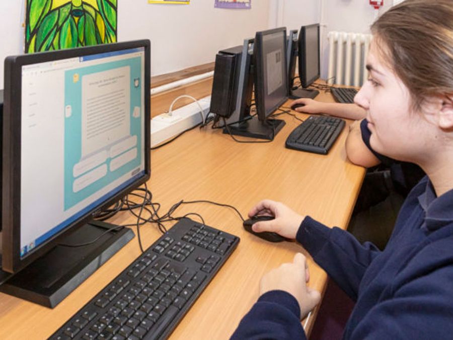 Student completing Bedrock on a computer